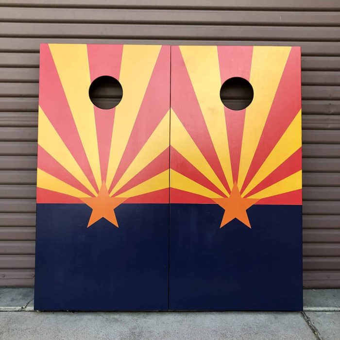 Arizona Love cornhole board with garage background