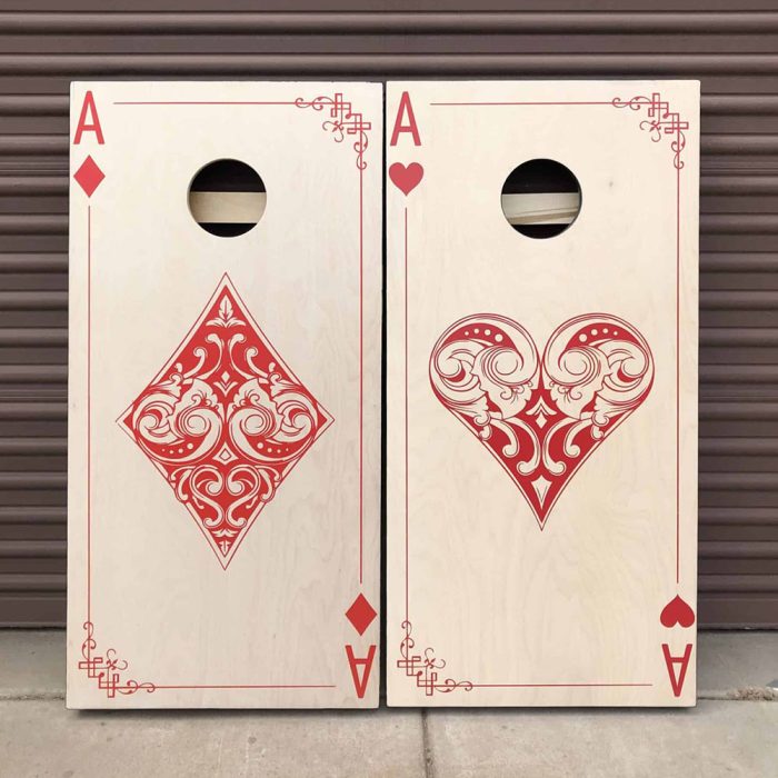 Ace of Diamonds / Ace of Hearts Cornhole Board set with garage background
