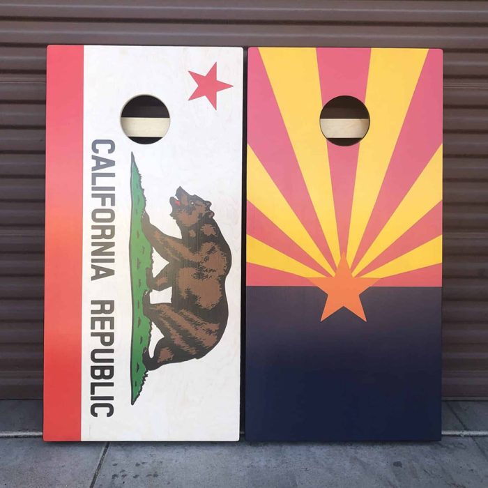 California / Arizona Flag Cornhole Board with garage background