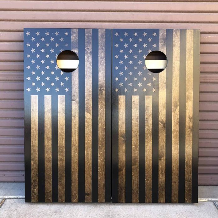 Classic Walnut American Flag cornhole board with garage background
