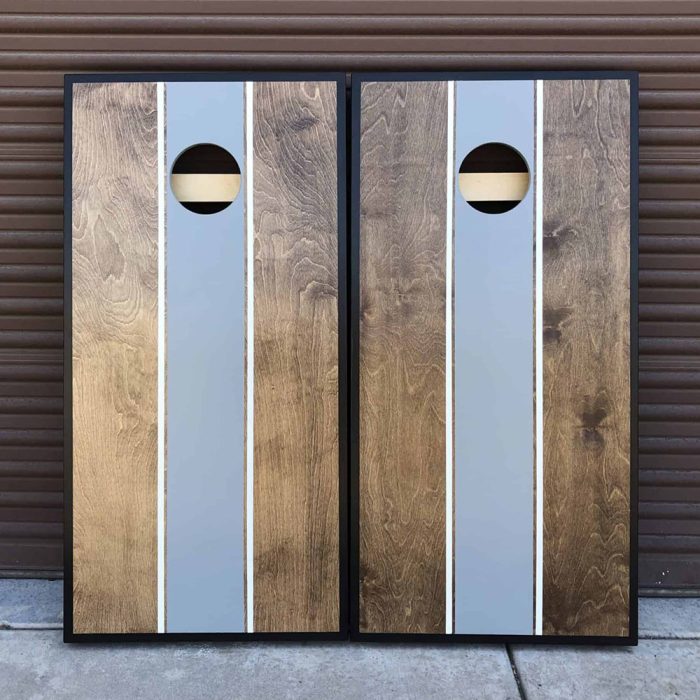 Classy Walnut and Grey cornhole board with garage background