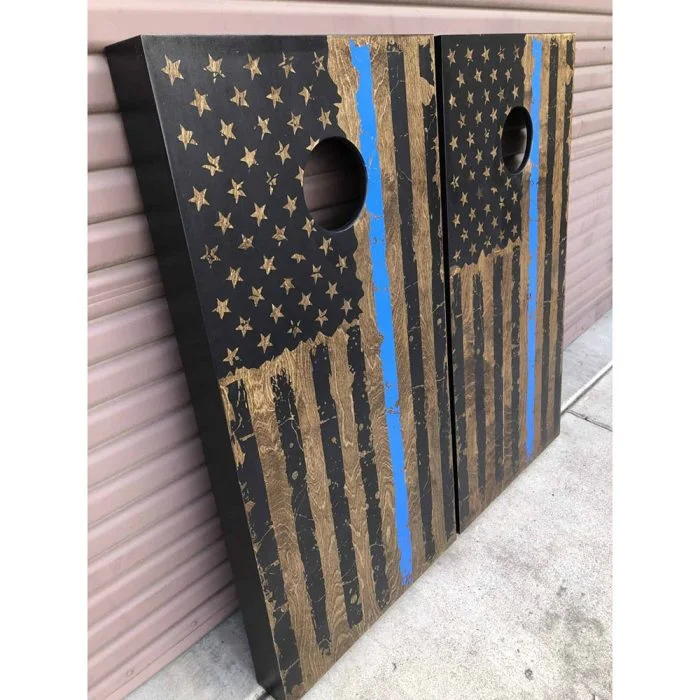 Walnut Thin Blue Line cornhole board with garage background