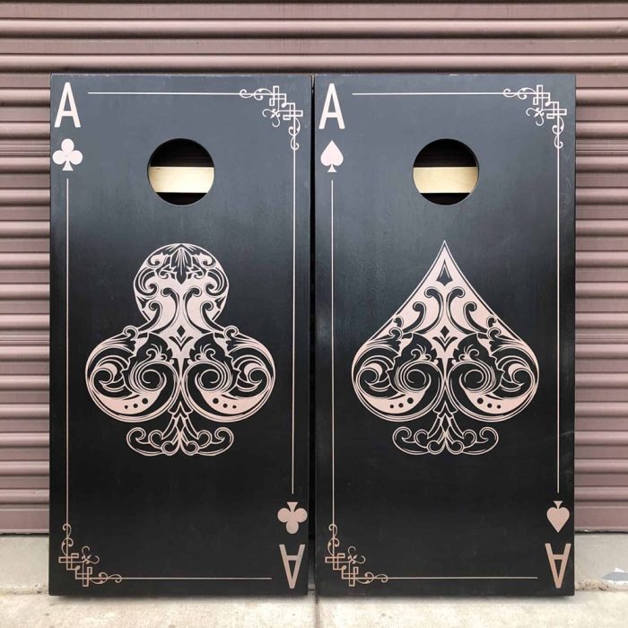 Ace of Spades / Ace of Clubs Cornhole Board set with garage background